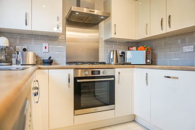 a kitchen with a microwave and kettle