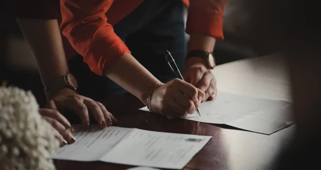 taxes and fees when buying a property in the uk people signing documents